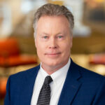 Headshot of Pete Fontaine wearing a suit and tie.